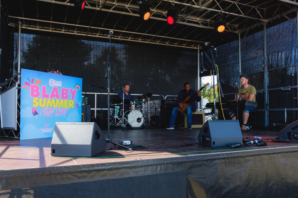 A jazz band play on a stage